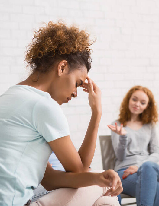Unhappy African American Woman Sitting On Therapy Session Indoor
